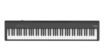 Black digital piano on a white background
